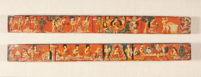 Two long rectangular manuscript covers decorated with proliferation of figures and scenes against orange backgrounds