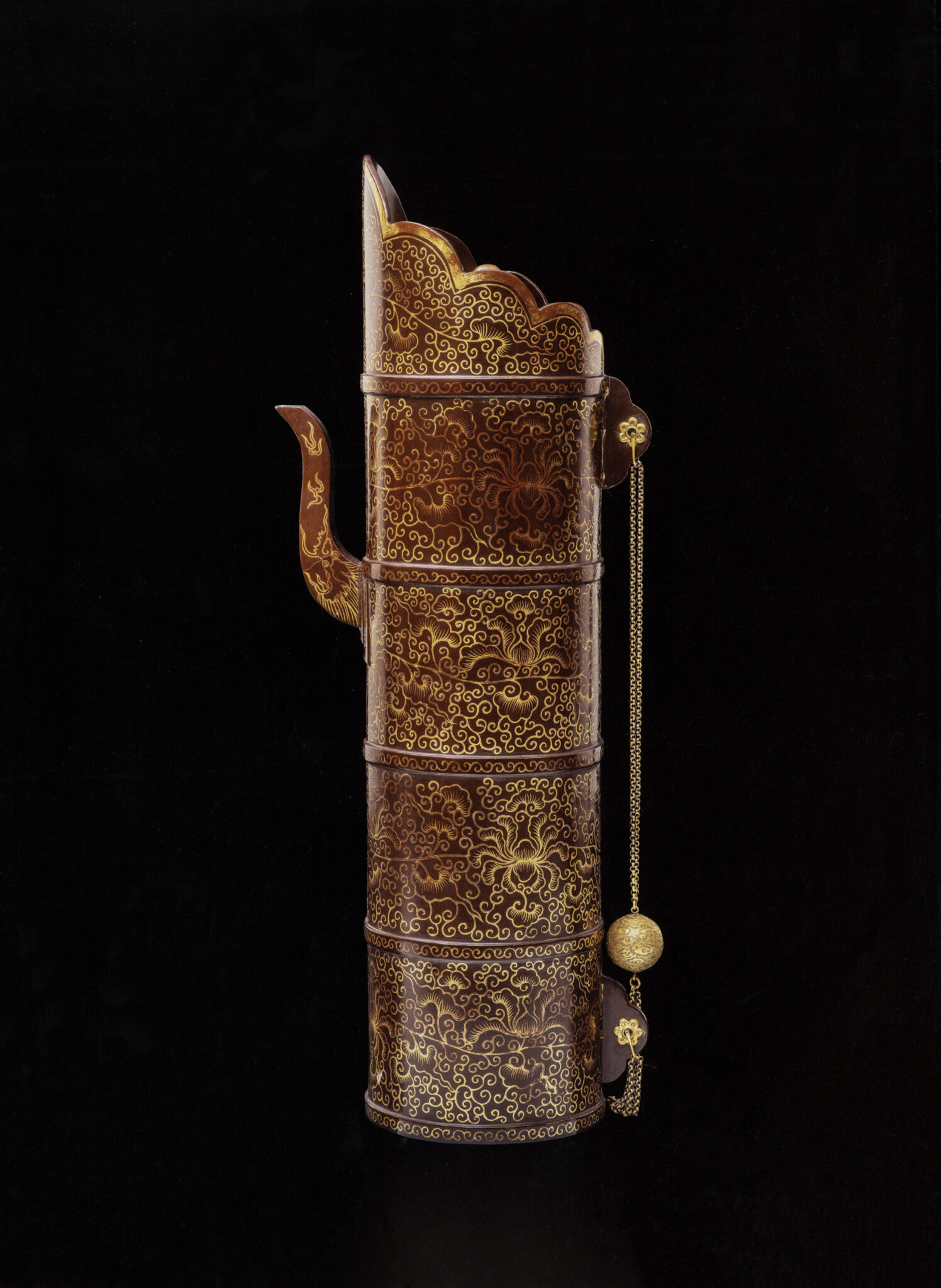 Tall, cylindrical, mahogany-colored pitcher featuring diminutive spout and golden floral motifs covering vessel body