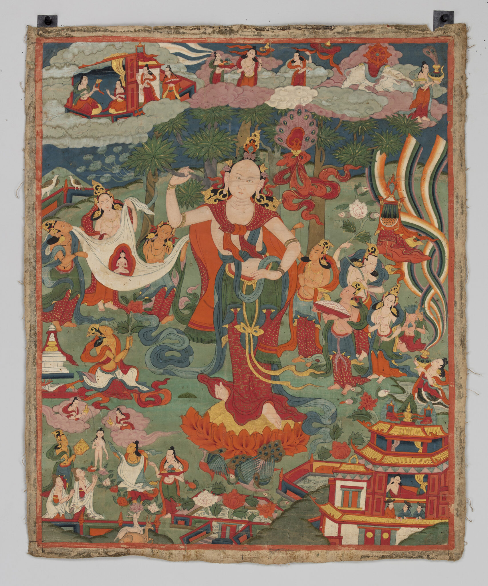 Jewel-toned deities, ribbons, and clouds swirl around richly-attired woman with hand on hip towering over landscape.