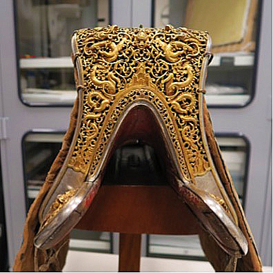 The fine details and considerable amount of gold used to decorate this saddle indicate the accessory was a luxury item and a status symbol.