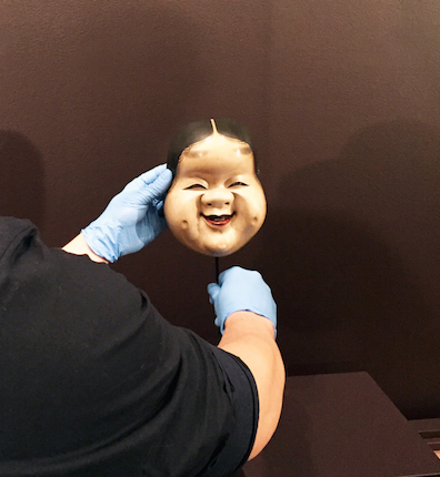 Installation of an Edo-period Ofuku mask from the collection of the Newark Museum.