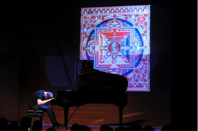 Craig Taborn ECM CD release concert in 2011, improvising in response to a mandala in the Rubin Museum's collection. Photo by Ed Berger.
