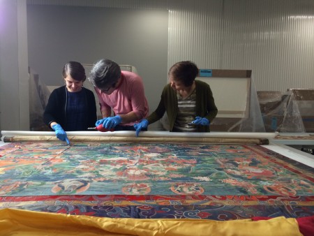 Members of the Rubin's curatorial and collections management departments take a closer look at the painting's many details