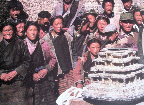 Local people return a silver model mandala hidden during the Cultural Revolution to Ralung Monastery. Photo: Stone Routes, 1985.