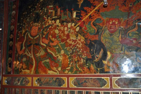 Assembly Hall Murals, Nechung Monastery, Lhasa. Photo by Christopher Bell, 2011. A Nechung Oracle is on the left while one of the Five Sovereign Spirits is on the right.