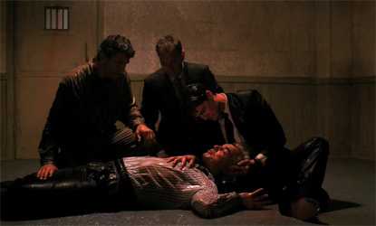 Agent cooper comforts Leland while he passes away.