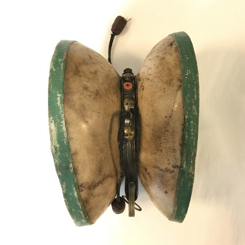 Hand-held Drum (Damaru); Tibet; date unknown; human bone, semi-precious stone, leather, pigment; Rubin Museum of Art; gift of G.W. VAn Keppel Trust; SC2022.5.1