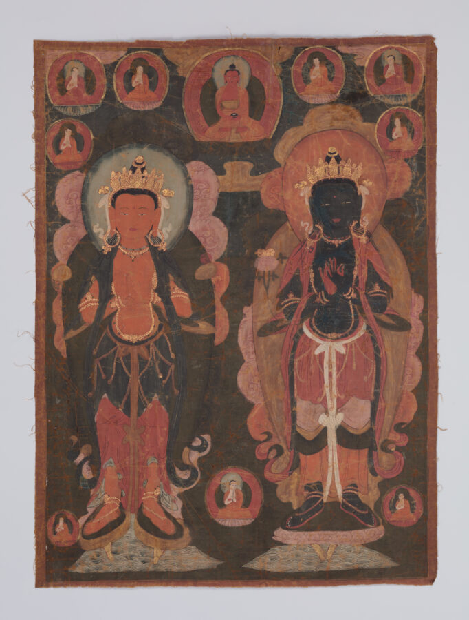 Two richly dressed figures stand side-by-side, facing frontally, against a dark background. Smaller seated figures of monks in circular motifs appear at the upper and lower portions of the painting.