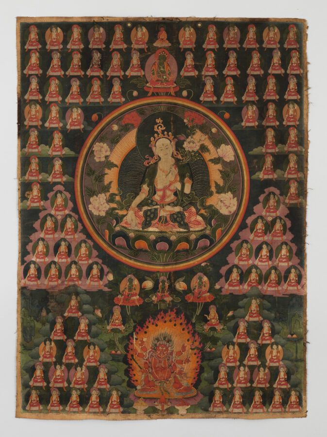 Thangka painting of a central crowned Buddhist deity in a circular halo, surrounded by many small rows of repeating, seated deities, with a flame-wreathed wrathful deity below.