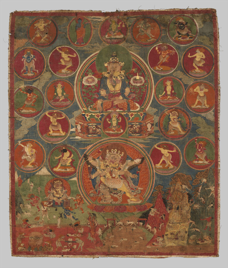 A detailed painting showing multiple deities, with a central seated figure and consort above and a fierce multi-armed deity and consort dancing within a ring of flames below. Other smaller deities in various poses are arranged around the three largest deities. A landscape with small human and nonhuman figures appears at the bottom.