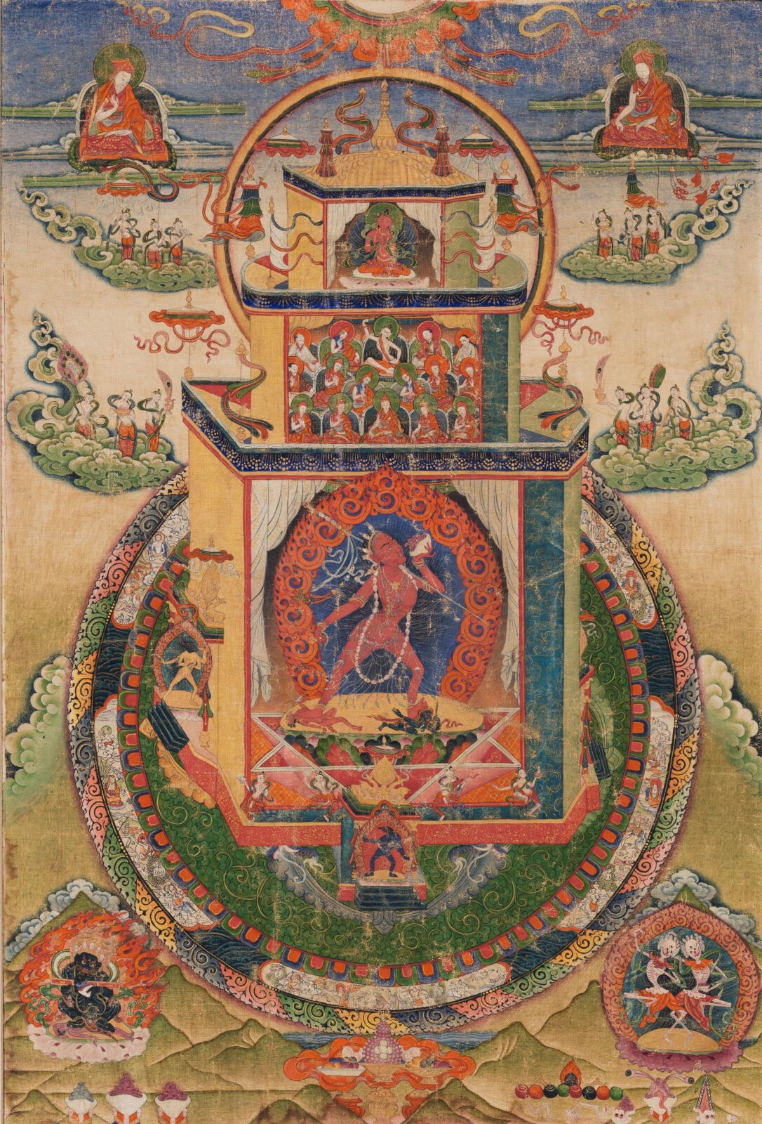 Thangka mandala painting centered on a red female deity within a temple structure, surrounded by concentric protective rings, with seated teachers above and small deity figures in the corners.