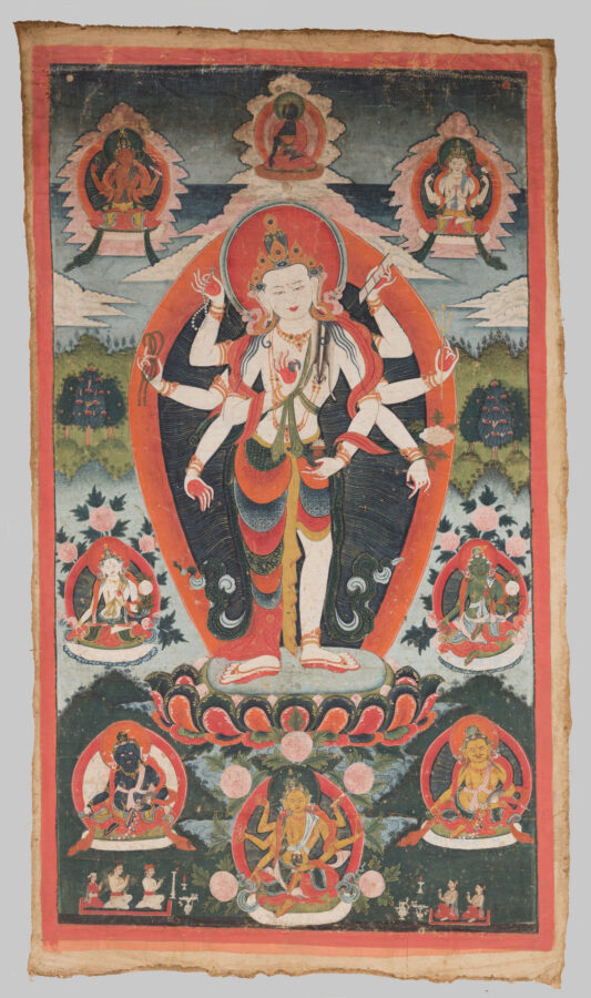Thangka painting of a standing multi-armed deity with a crown and orange aureole, poised on a lotus base, surrounded by six smaller seated deities in framed roundels and a green landscape background.