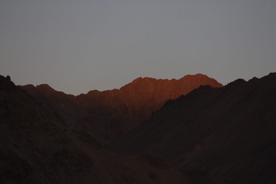 Disko Valley lit by the sun, emitting a deep orange hue