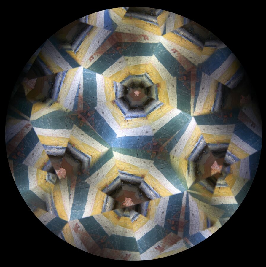 Kaleidoscopic image of blue-green, white and yellow lines.