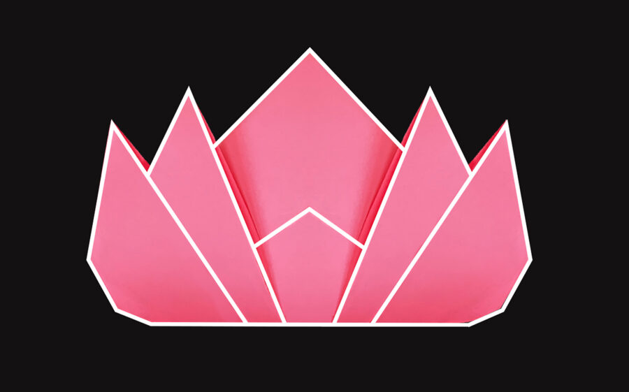 Pink paper folded into a lotus flower on black background.