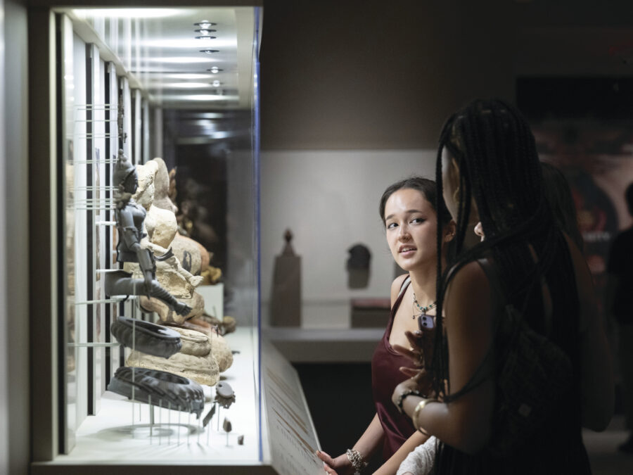 two adults looking at the installation of Process of Lost-Wax Metal Casting