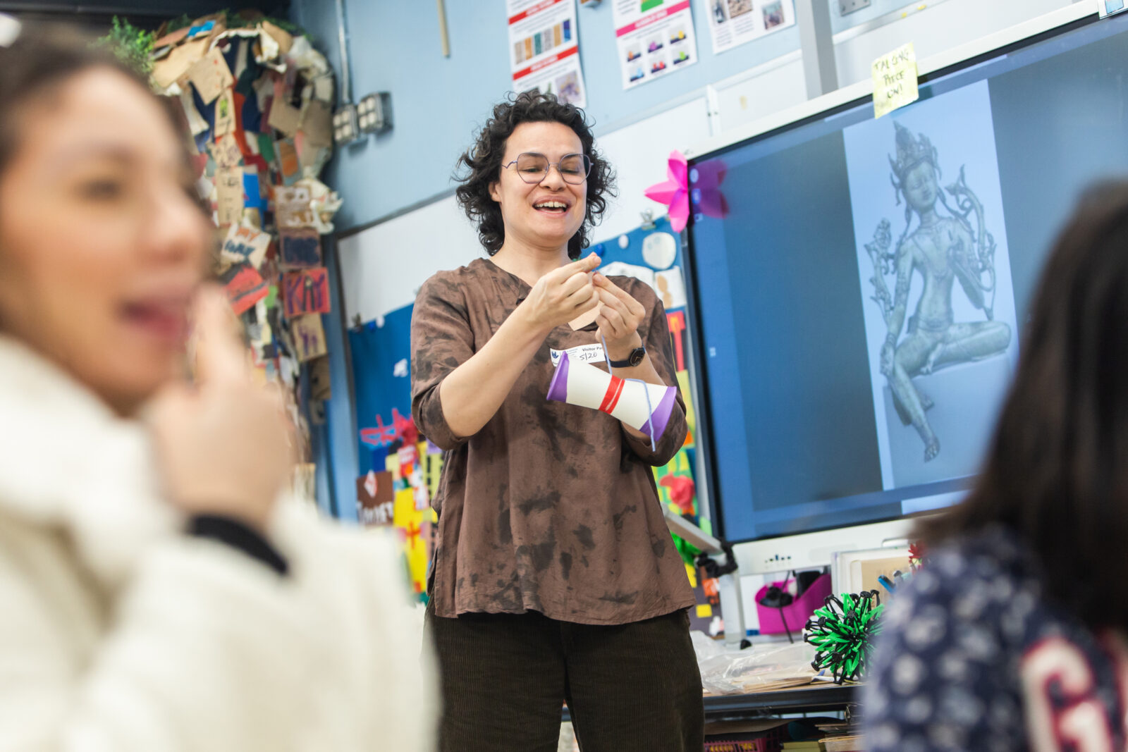 teaching artist leading a lesson in the classroom
