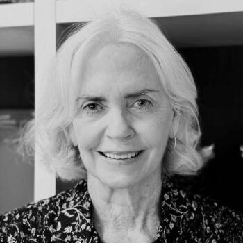 black and white photo of a smiling woman