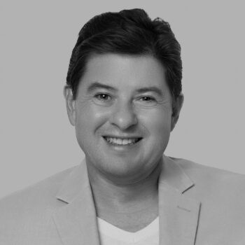 black and white photo of a man smiling