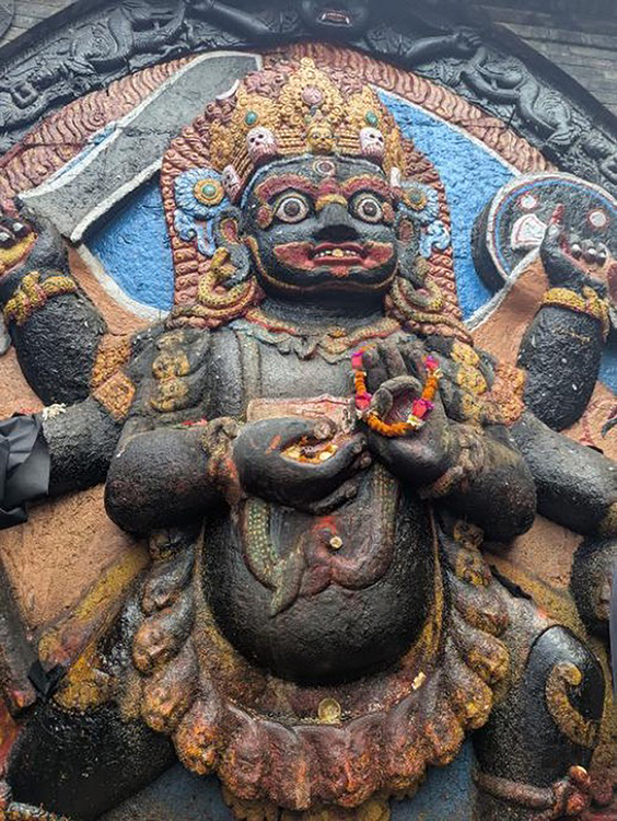 A low-angle close-up photo of the Kaal Bhairava statue in Durbar Square, Kathmandu