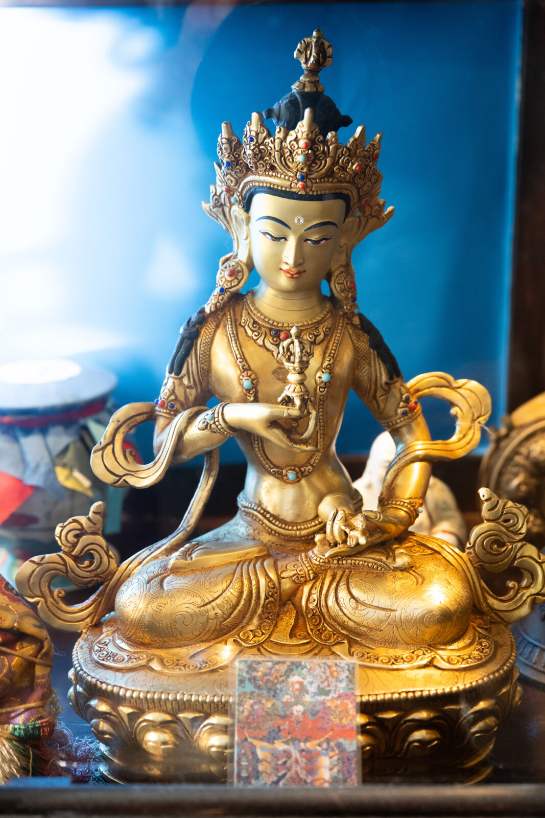 a statue of dorje sempa in a household shrine room
