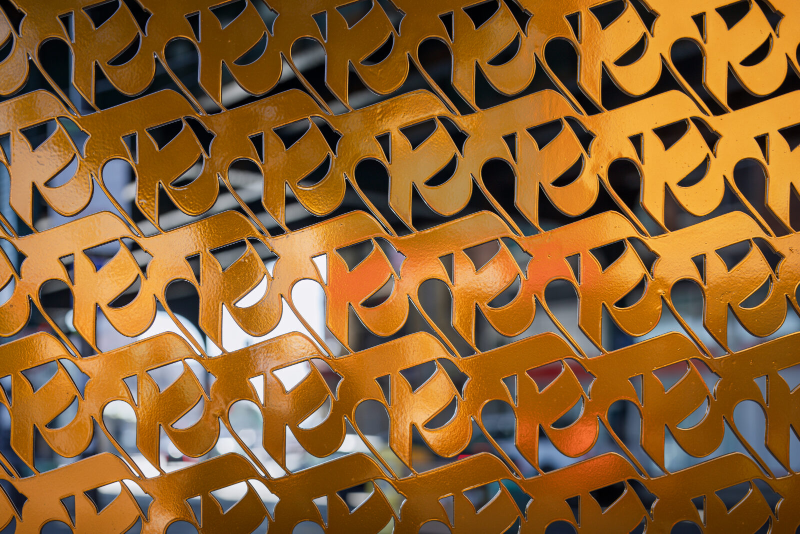 Close up of IMAGINE's (a.k.a. Sneha Shrestha) sculpture, About a Living Culture, focusing on the gold rows of ka, the first letter of the Nepali alphabet