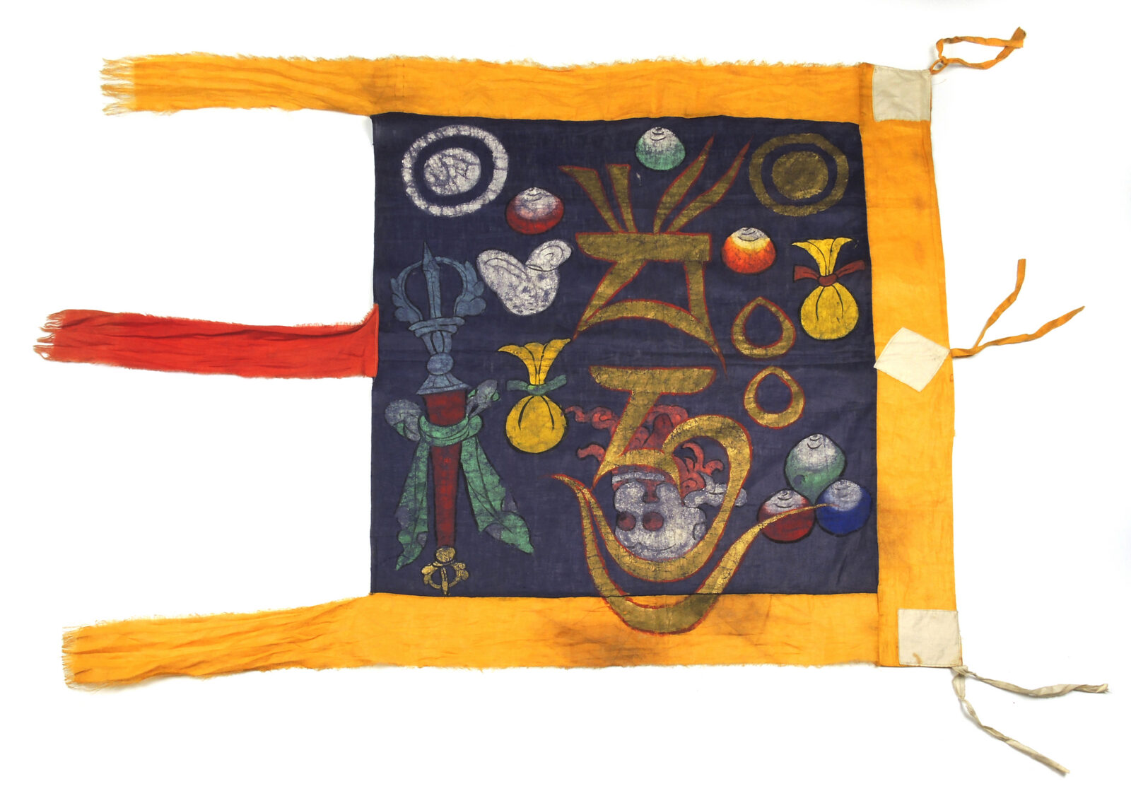 dark blue square fabric with a colorful design, bordered by yellow fabric on the top, right, and bottom, with red fabric sewn to the left