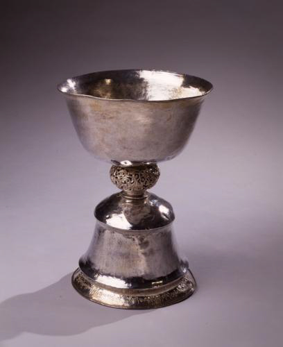 Silver cup with base.