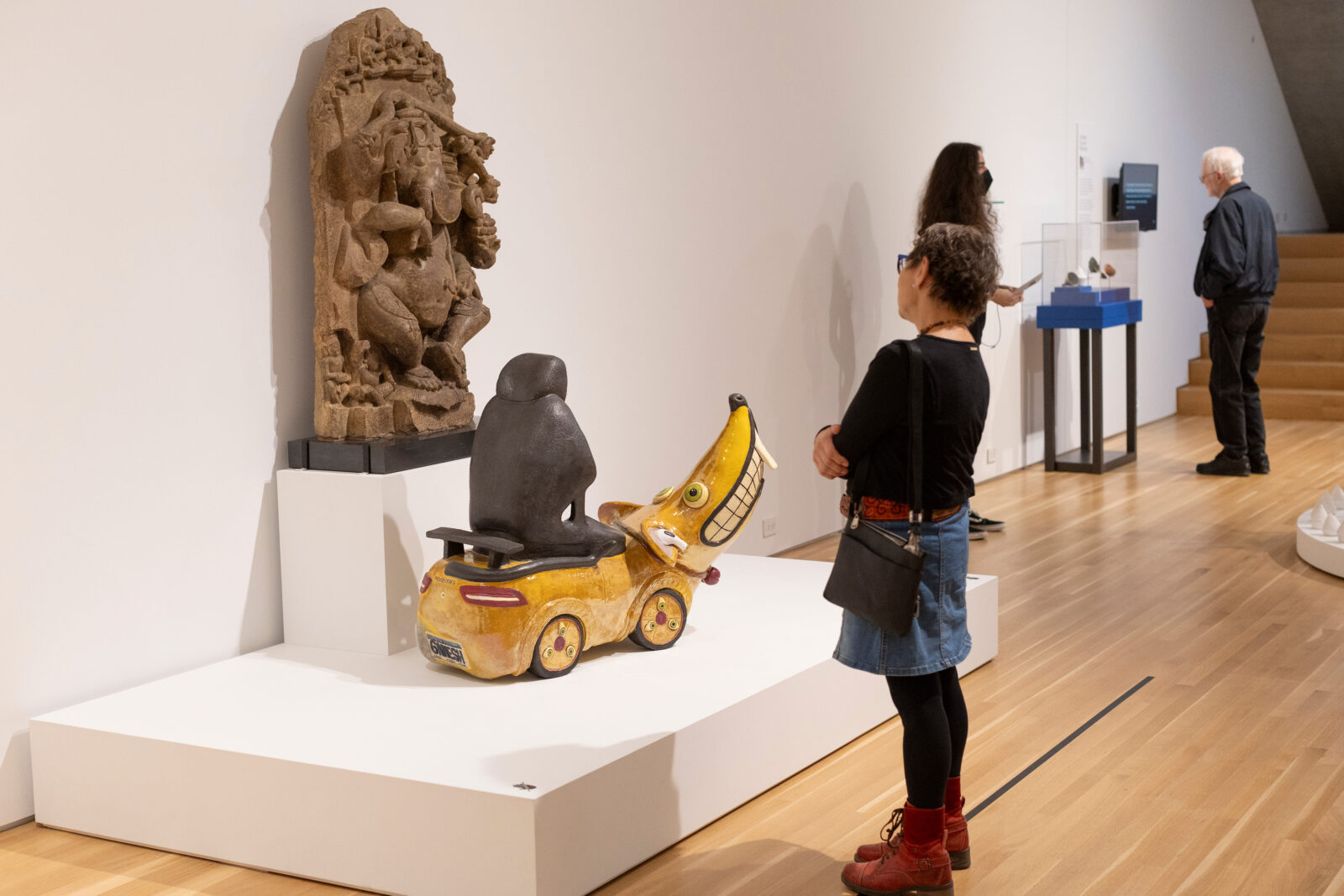 Museum visitor standing in front of Uber Rat sculpture by Shushank Shrestha at the "Reimagine: Himalayan Art Now" exhibition in Chicago