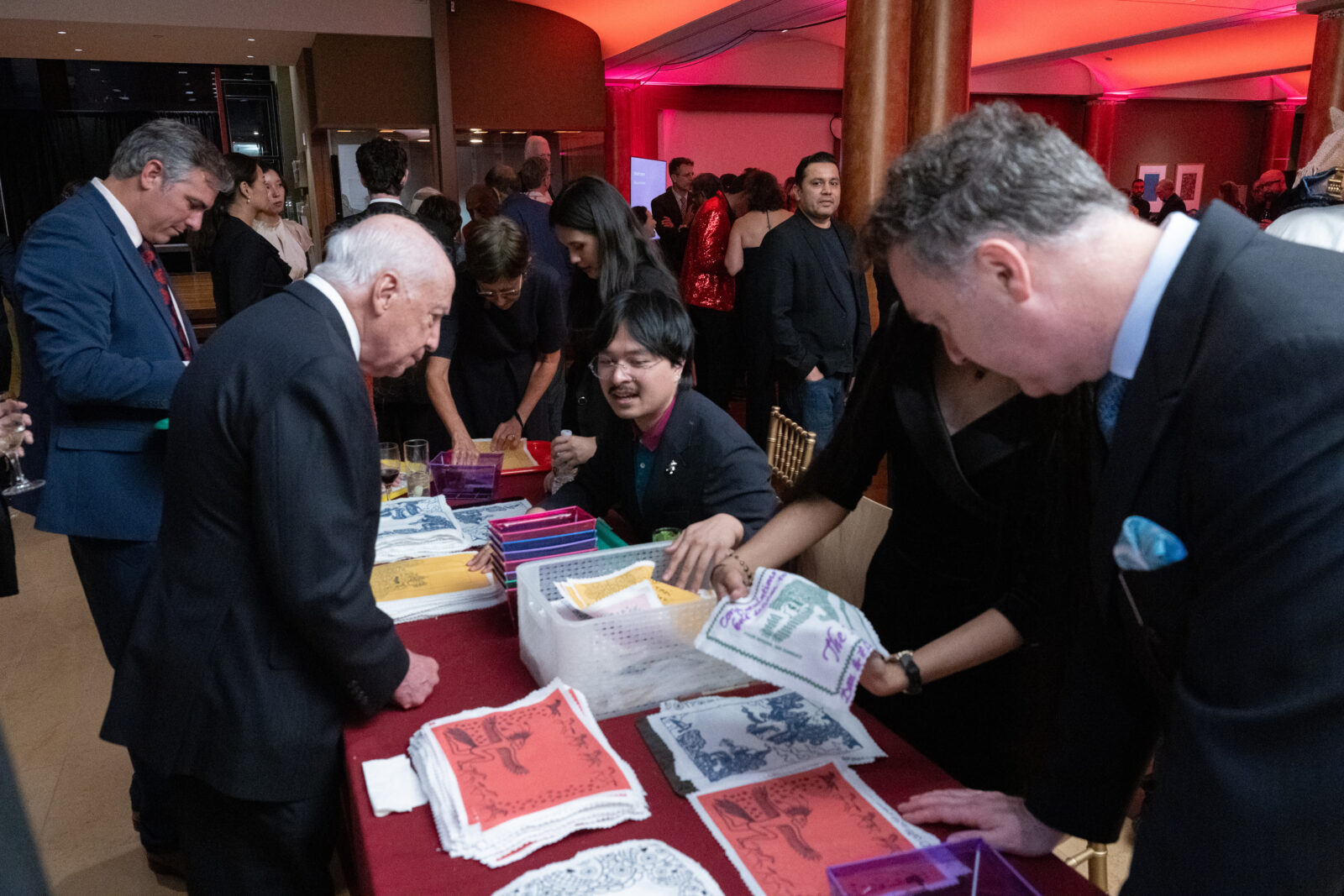 Rubin Museum Gala guests writing on prayer flags at the Museum