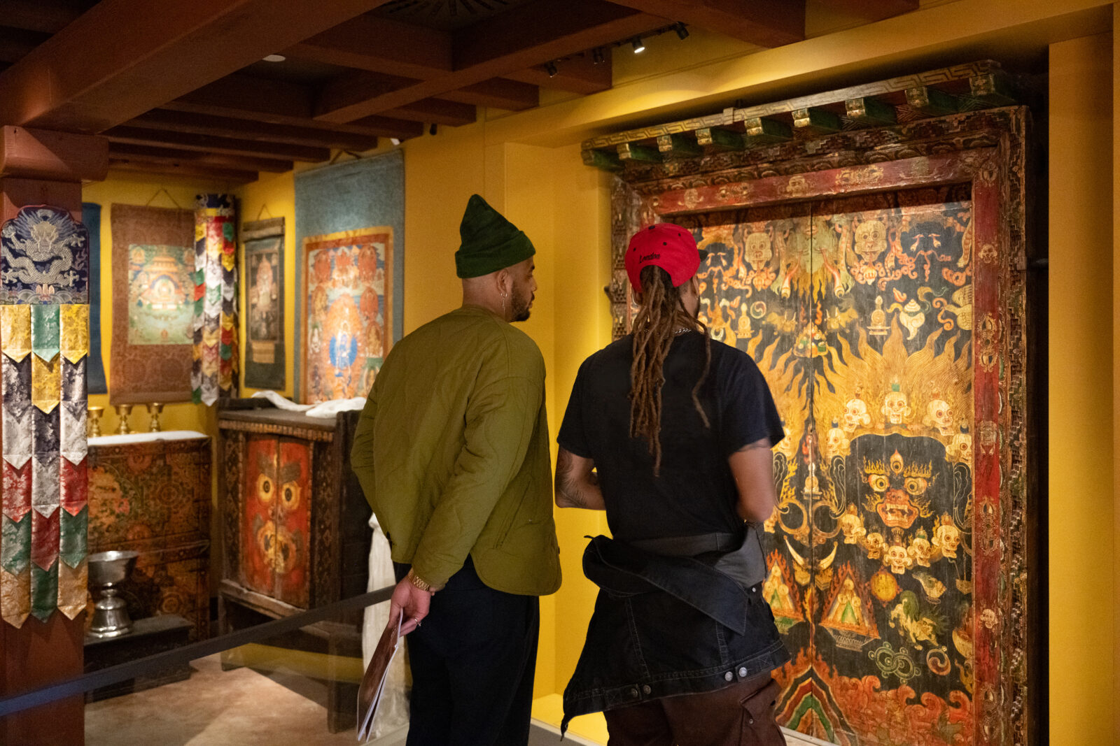 two visitors looking at the Rubin Museum tibetan buddhist shrine room