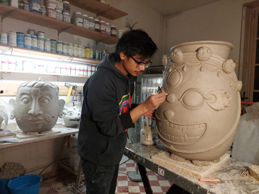 artist shushank shrestha working in clay studio on a sculpture
