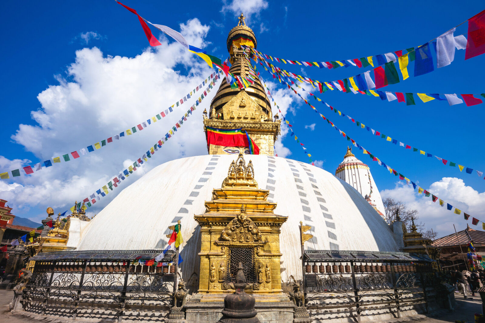 Svayambhu Stupa in the Kathmandu Valley decorated with colorful Losar prayer flags