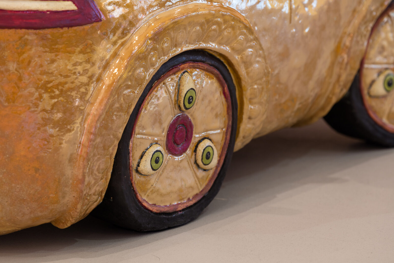 wheel detail with three eyes from a larger sculpture by Shushank Shrestha