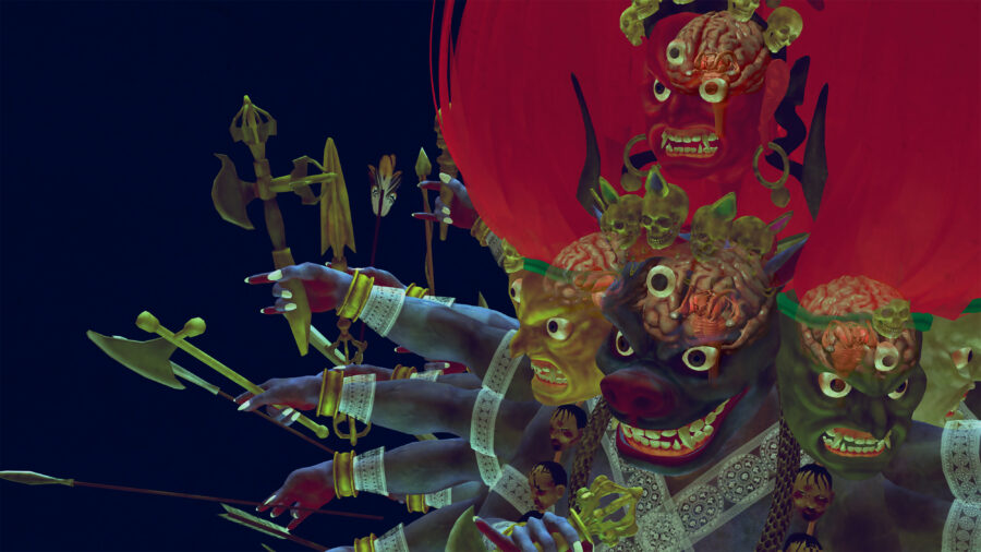 Video still of a four-headed, ten-armed figure with red hair in front of a blue background, with each arm holding a different object