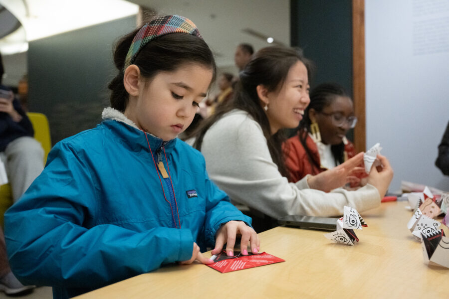 A child concentrating on an art project at the Rubin Museum